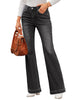Model poses wearing black mid-waist stretchable straight leg denim jeans