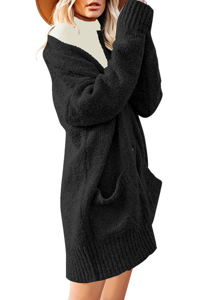 Side view of model wearing black button down drop shoulders oversized knit cardigan