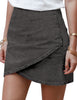 Angled view of model wearing black tulip ruched denim mini skirt