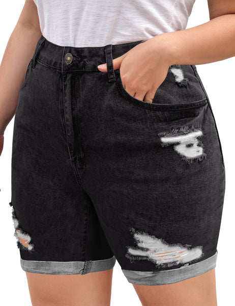 Side view of model wearing black high-waist cuffed hem distressed denim biker shorts