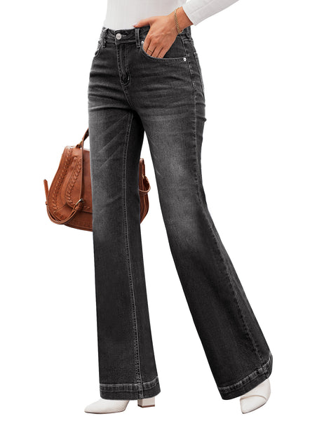 Side view of model wearing black mid-waist stretchable straight leg denim jeans
