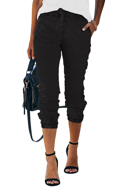 Model wearing black elastic-waist welt pockets denim jogger pants