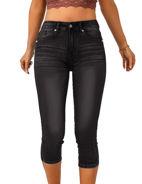 Front view of model wearing black below knee skinny fit jeans shorts