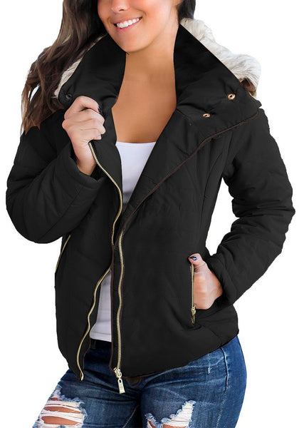 Model poses wearing black faux fur hooded zip up quilted jacket 