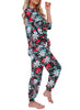 Side view of model wearing black christmas snowflake drawstring-waist jogger pajama set