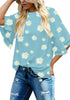 Model poses wearing light blue trumpet sleeves keyhole-back daisy printed blouse