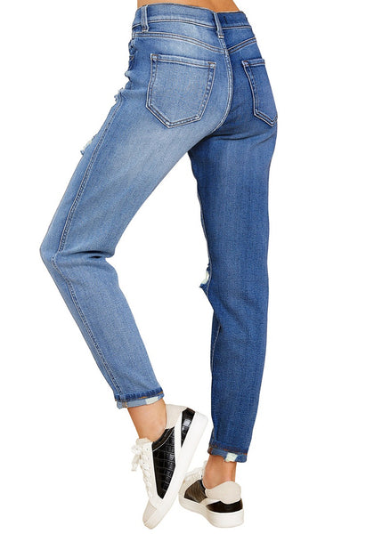 Back view of model wearing azure blue color block cuffed ripped denim boyfriend jeans