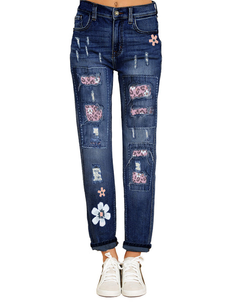 Front view of model wearing pink floral-print patch ripped rolled hem denim boyfriend jeans