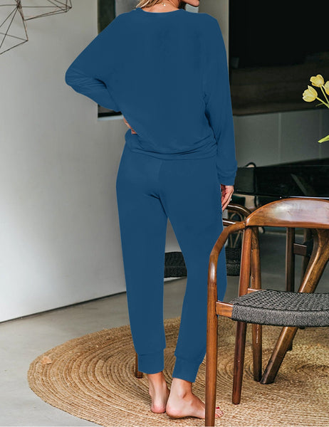 Back view of model wearing dark teal long sleeves tie-dye drawstring jogger lounge set