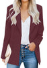 Front view of model wearing burgundy lapel front-button side-pockets blazer