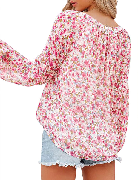 Back view of model wearing coral long sleeves V-neckline floral-print boho blouse