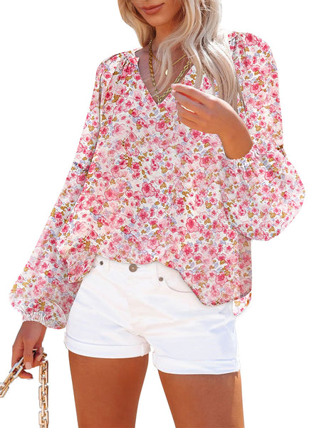 Front view of model wearing coral long sleeves V-neckline floral-print boho blouse