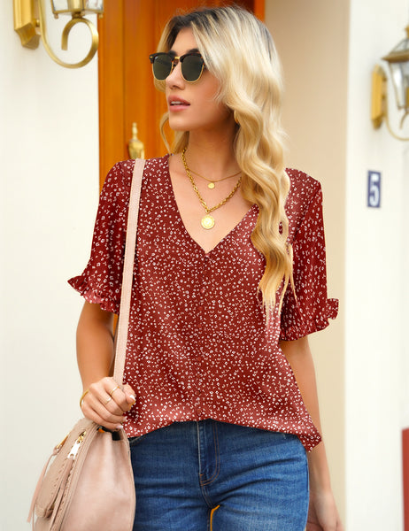 Front view of model wearing rust red ruffle trim short sleeves printed V-neck button-down top