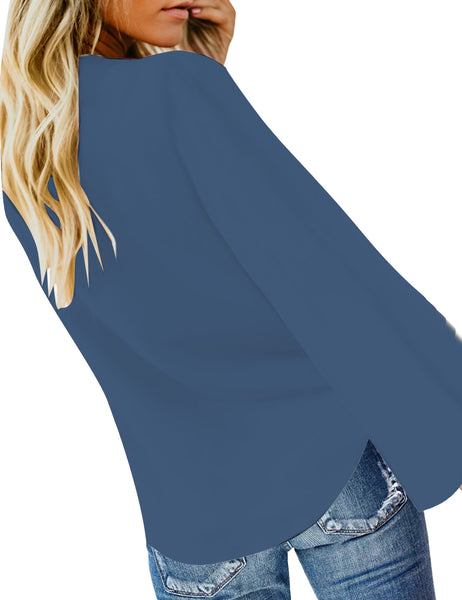 Back view of model wearing blue v-neckline button-up tie-front top