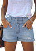 Front view of model wearing light blue high-waist double button cuffed hem ripped denim shorts