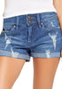 Front view of model wearing medium blue roll-over hem double button distressed denim shorts