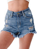 Font view of model wearing blue high-waist frayed raw hem ripped denim shorts