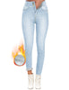 Model wearing light blue triple button fleece-lined skinny denim jeans