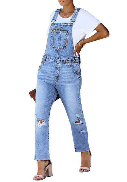 Angled shot of model wearing blue straight cut distressed denim jeans overall