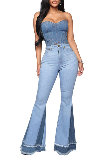 Full front view of model wearing medium blue stretchy frayed hem flared denim jeans