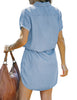 Back view of model wearing light blue elastic waist curved hem button down denim shirt dress
