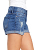 Side view of model wearing medium blue roll-over hem double button distressed denim shorts