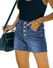 Angled shot of model wearing blue raw hem mid-waist distressed denim shorts