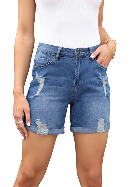 Front view of model wearing light blue rolled hem mid-waist distressed denim shorts