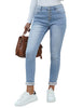 Angled view of model wearing light blue fleece-lined button-down denim skinny jeans