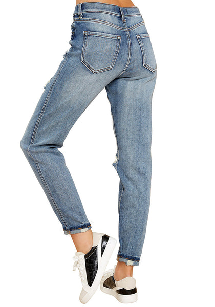 Back view of model in light blue cuffed ripped denim boyfriend jeans