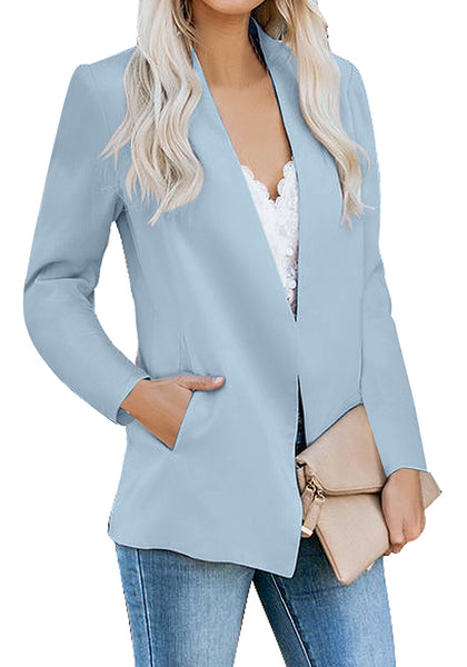 Angled shot of model wearing light blue open-front side pockets blazer