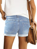 Back view of model wearing light blue mid-waist rolled hem distressed denim shorts