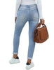 Back view of model wearing light blue fleece-lined button-down denim skinny jeans