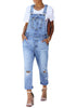Model wearing blue straight cut distressed denim jeans overall
