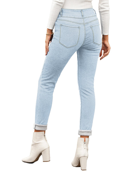 Back view of model wearing light blue triple button fleece-lined skinny denim jeans