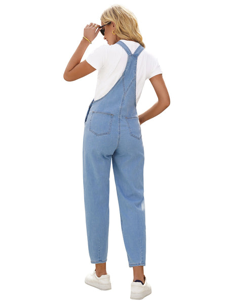 Back view of model wearing light blue cuffed denim bib jeans overalls