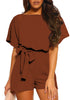 Posing model wearing burgundy short sleeves keyhole-back belted romper