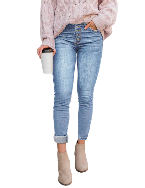 Model wearing light blue fleece-lined button-down denim skinny jeans