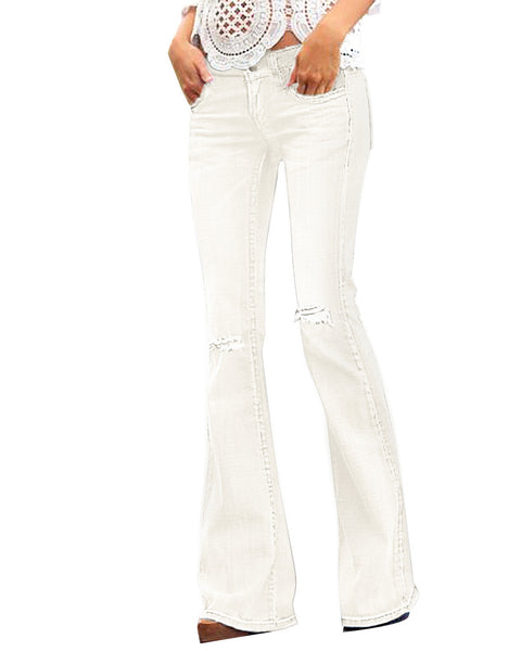 Model wearing white ripped knee flared denim jeans