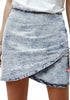 Front view of model wearing grey acid wash tulip ruched denim mini skirt