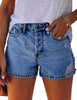 Front view of model wearing blue mid-waist distressed washed denim shorts