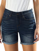 Front view of model wearing dark blue rolled hem slim fit denim shorts