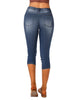 Back view of model wearing blue below knee skinny fit jeans shorts