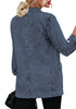 Back view of model wearing deep blue lapel collar flap pockets open-front denim blazer