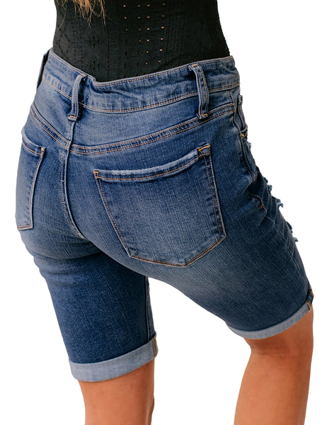 Back view of model wearing deep blue women mid-waist frayed bermuda denim shorts