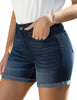 Side view of model wearing dark blue rolled hem slim fit denim shorts