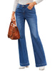 Model poses wearing blue mid-waist stretchable straight leg denim jeans