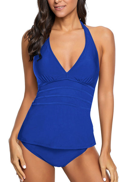 Front view of model wearing royal blue solid color halter tankini set