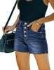 Model wearing dark blue raw hem mid-waist distressed denim shorts