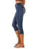 Side view of model wearing blue below knee skinny fit jeans shorts
